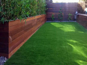 Neatly installed artificial grass on a backyard